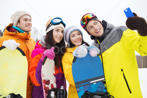 Heureux amis smartphone sports d'hiver loisirs amitié [[stock_photo]] © dolgachov