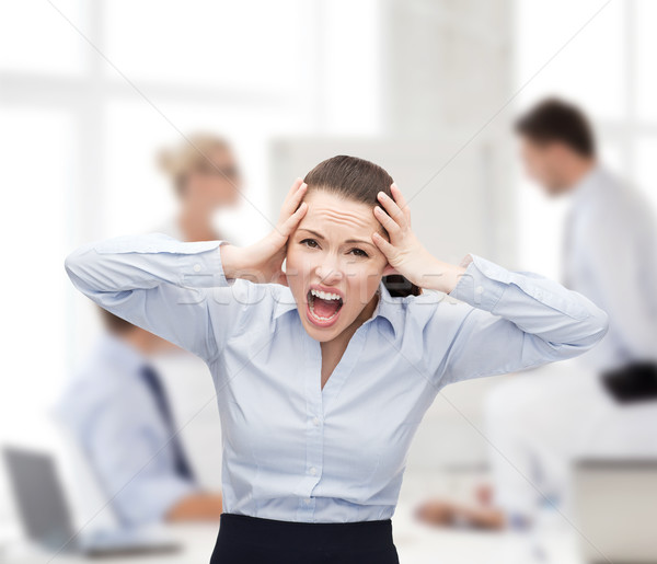 angry screaming businesswoman Stock photo © dolgachov