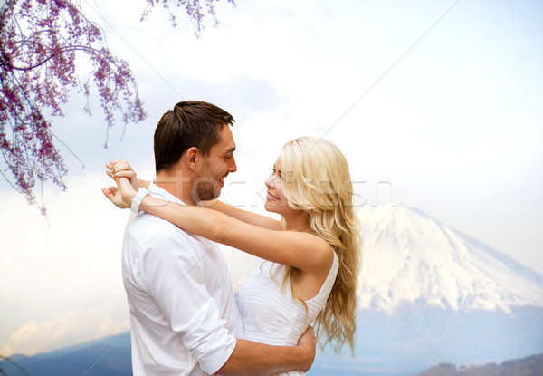 happy couple hugging  over fuji mountain in japan Stock photo © dolgachov
