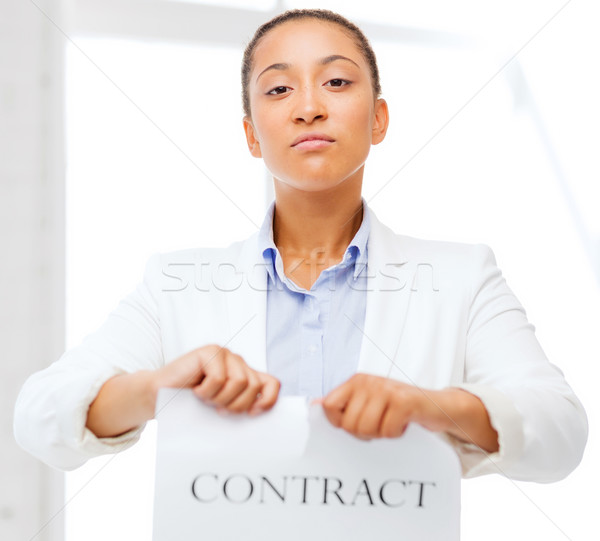 african businesswoman tearing contract Stock photo © dolgachov