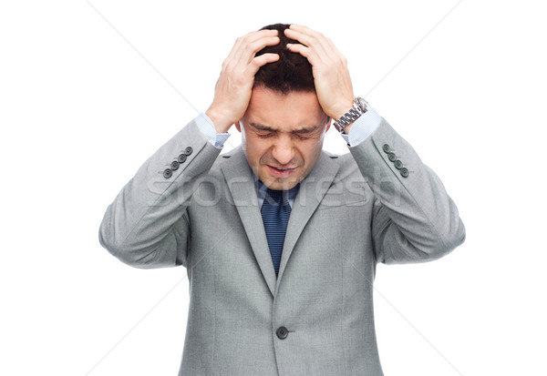 businessman in suit having head ache Stock photo © dolgachov