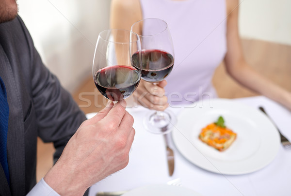 young couple with glasses of wine at restaurant Stock photo © dolgachov