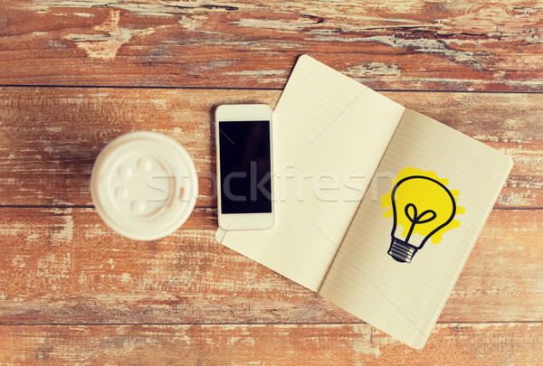 close up of notebook, coffee cup and smartphone Stock photo © dolgachov