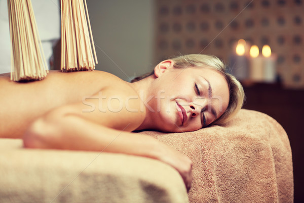 Stock photo: close up of woman having samurai massage in spa