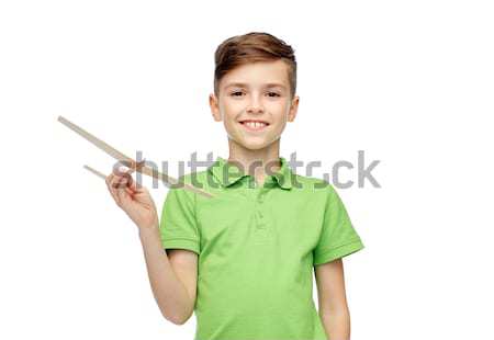 happy boy in green polo t-shirt pointing finger up Stock photo © dolgachov
