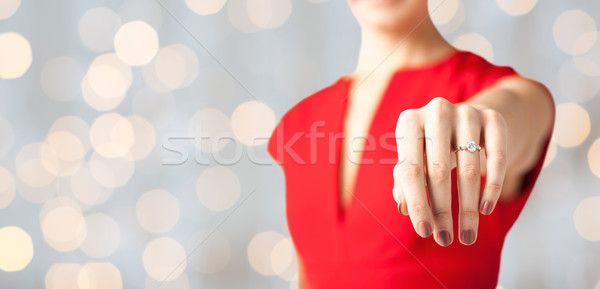close up of woman showing wedding ring on her hand Stock photo © dolgachov