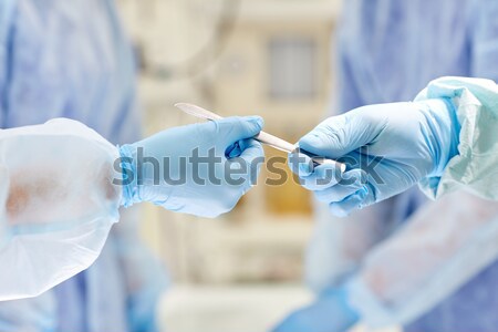 close up of scientists filling test tube in lab Stock photo © dolgachov