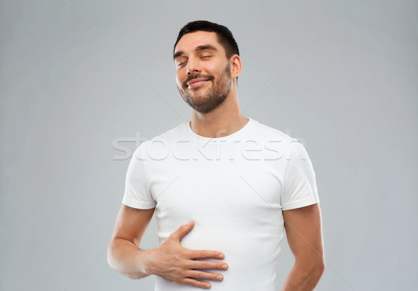 Boldog tele férfi megérint pocak szürke Stock fotó © dolgachov
