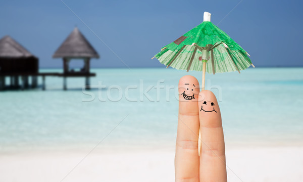 Twee vingers cocktail paraplu gebaar Stockfoto © dolgachov