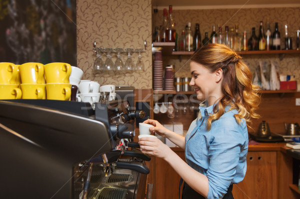 barista woman making coffee by machine at cafe Stock photo © dolgachov