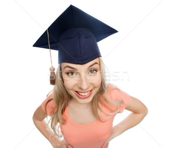 smiling young student woman in mortarboard Stock photo © dolgachov