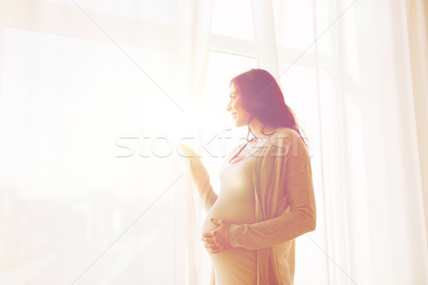 Foto stock: Feliz · mulher · grávida · olhando · janela · gravidez