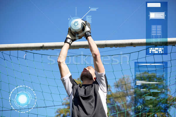 goalkeeper with ball at football goal on field Stock photo © dolgachov