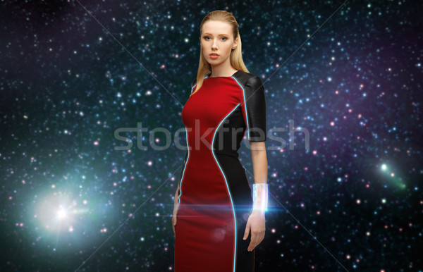 Stock photo: futuristic woman with transmitter in space