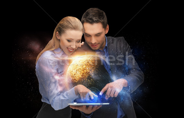 businesspeople with tablet pc and planets in space Stock photo © dolgachov
