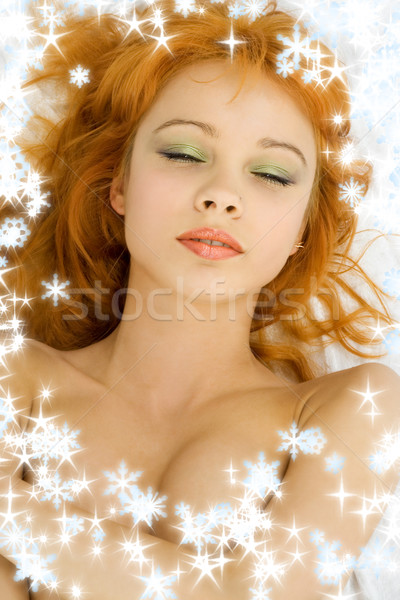 dreaming redhead with snowflakes Stock photo © dolgachov