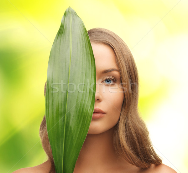 woman with green leaf Stock photo © dolgachov