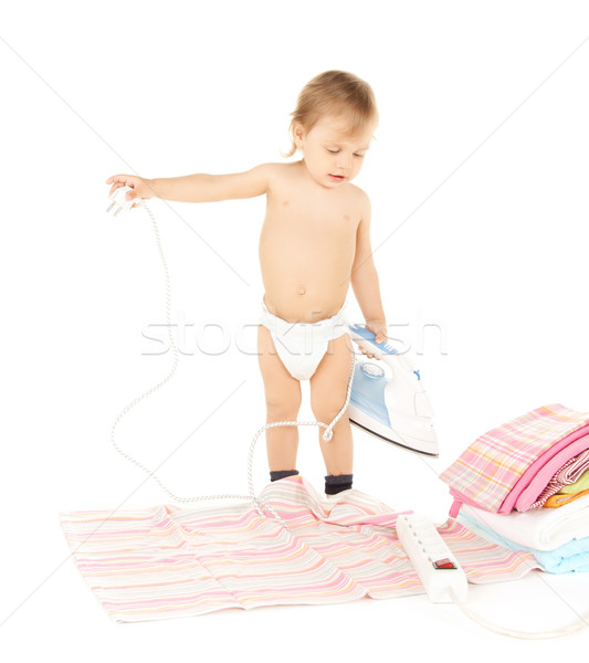 baby plugging in iron Stock photo © dolgachov