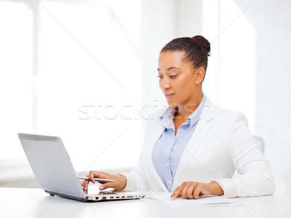 african businesswoman writing something Stock photo © dolgachov