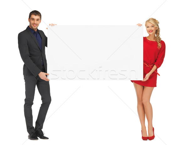 couple holding big blank white board Stock photo © dolgachov