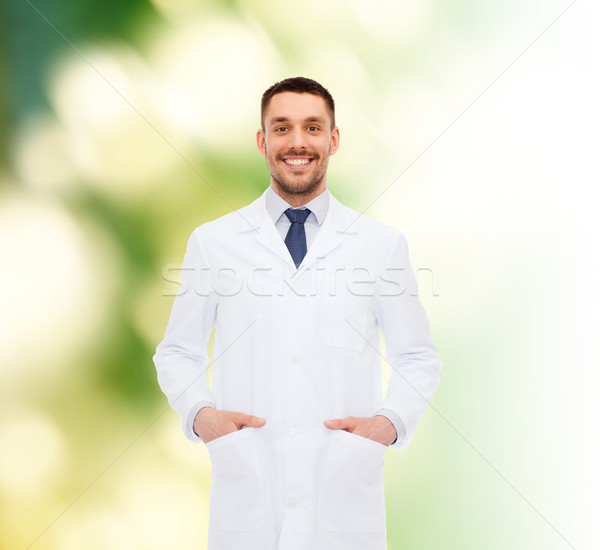 smiling male doctor in white coat Stock photo © dolgachov