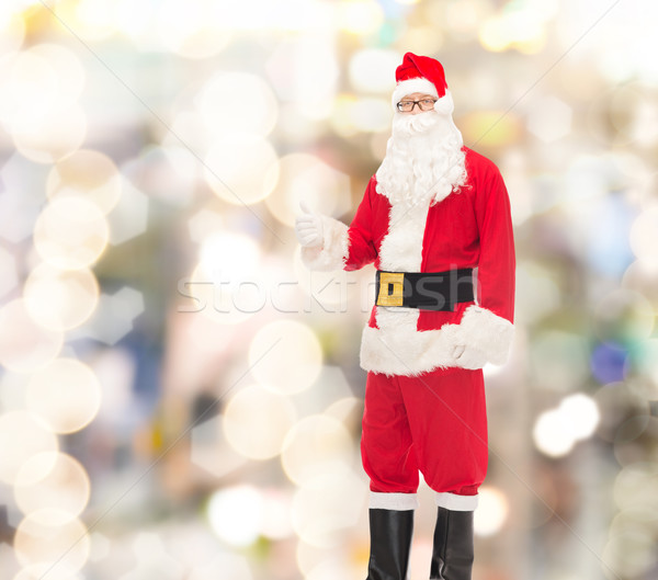 Man kostuum kerstman tonen christmas Stockfoto © dolgachov