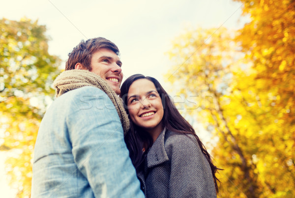 smiling couple hugging in autumn park Stock photo © dolgachov