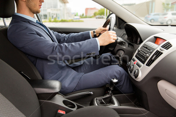 close up of young man in suit driving car Stock photo © dolgachov