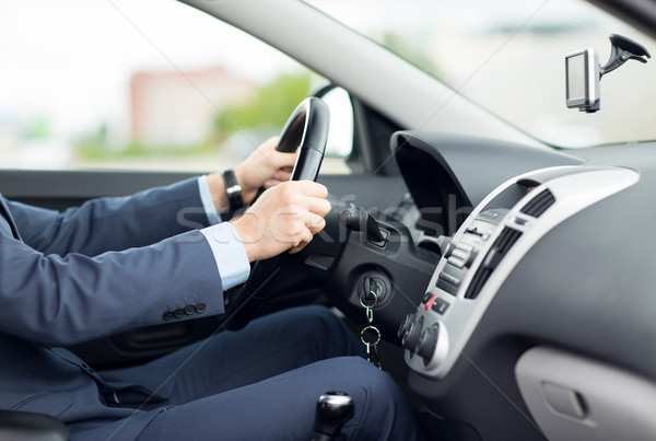 close up of young man in suit driving car Stock photo © dolgachov