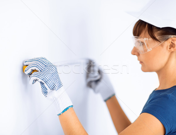 architect measuring wall with flexible ruller Stock photo © dolgachov