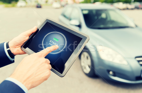 close up of hands with car starter on tablet pc Stock photo © dolgachov