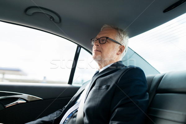 старший бизнесмен вождения автомобилей назад сиденье Сток-фото © dolgachov