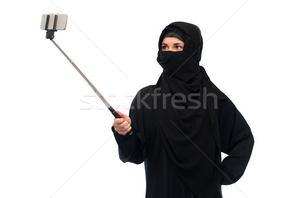muslim woman in hijab taking selfie by smartphone Stock photo © dolgachov