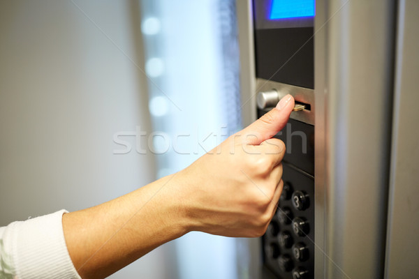 hand inserting euro coin to vending machine Stock photo © dolgachov