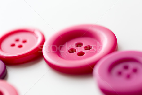 red and pink sewing buttons on white background Stock photo © dolgachov
