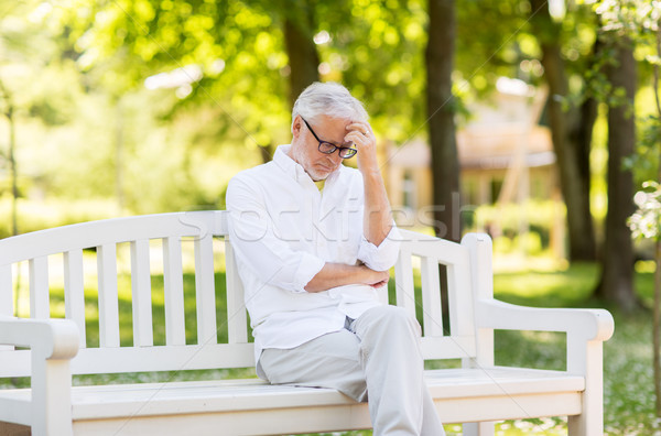 thoughtful senior man at summer park Stock photo © dolgachov