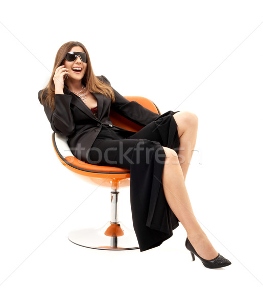 Işkadını telefon turuncu sandalye beyaz kadın Stok fotoğraf © dolgachov