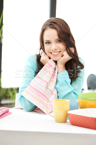 lovely housewife at the kitchen Stock photo © dolgachov