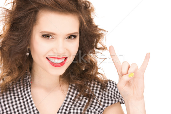 happy teenage girl showing devil horns gesture Stock photo © dolgachov