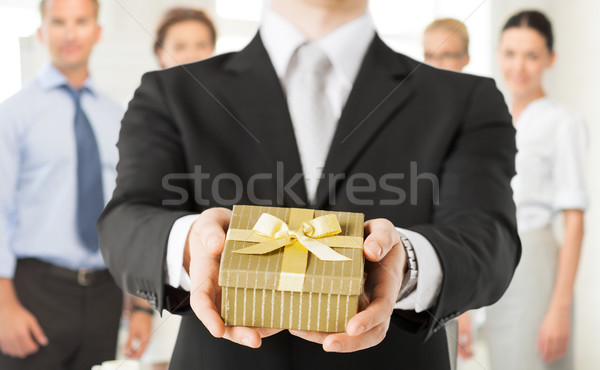 Homme mains coffret cadeau bureau [[stock_photo]] © dolgachov