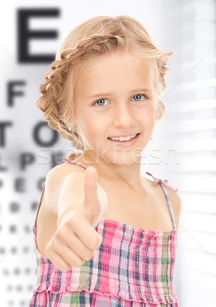 girl with optical eye chart Stock photo © dolgachov