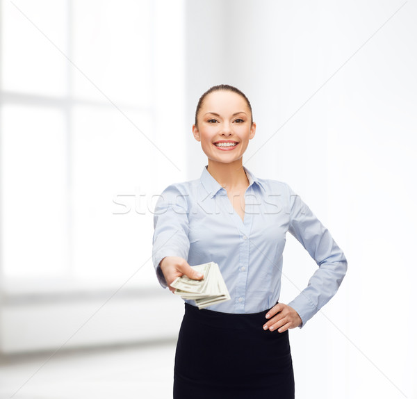 Stock photo: young businesswoman with dollar cash money