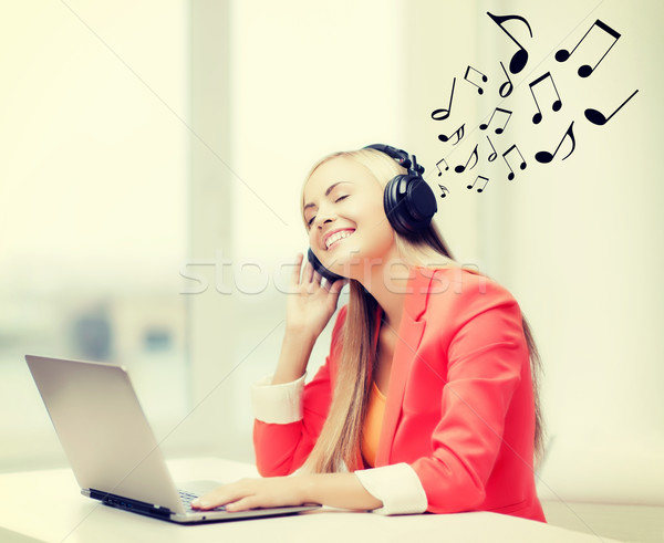 happy woman with headphones listening to music Stock photo © dolgachov