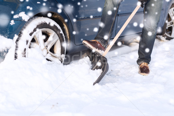closeup of man digging snow with shovel near car Stock photo © dolgachov