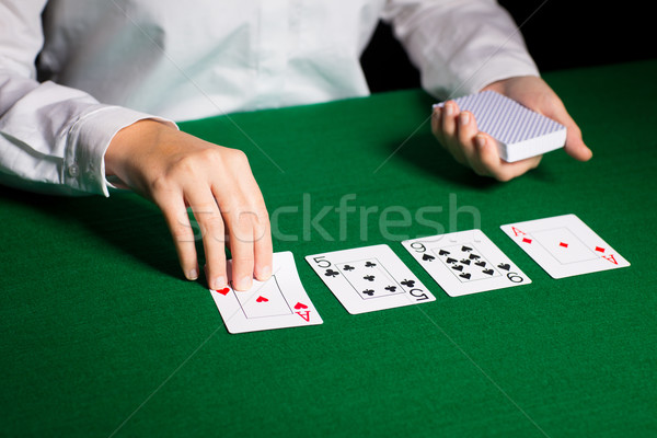 holdem dealer with playing cards Stock photo © dolgachov