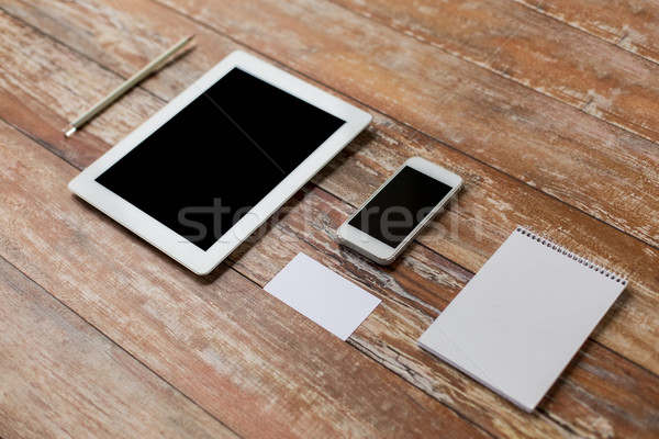 Stock photo: close up of notebook, tablet pc and smartphone