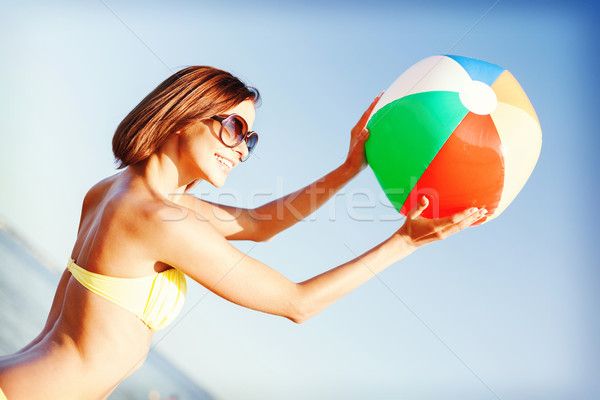 girl in bikini playing ball on the beach Stock photo © dolgachov