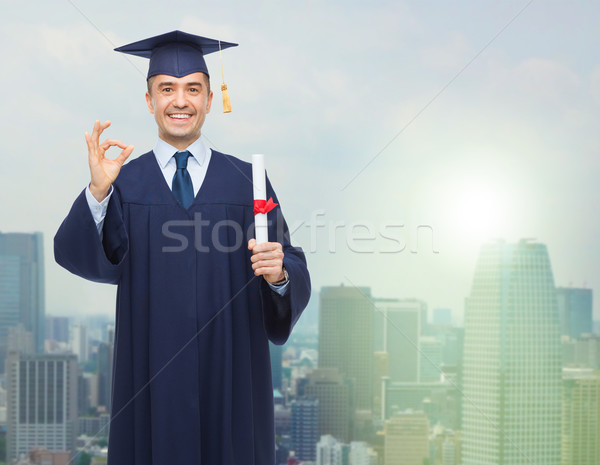 Sonriendo adulto estudiante diploma educación graduación Foto stock © dolgachov