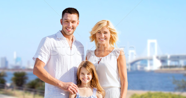 happy family over rainbow bridge background Stock photo © dolgachov