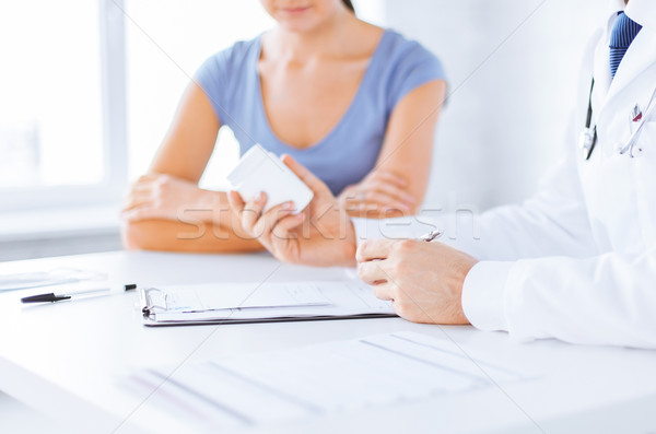 Stock photo: patient and doctor prescribing medication